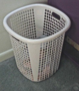 Simple dirty laundry collection system works best if there is a basket handy for everyone.