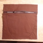 zipper section of pocket is sewn to the back facing