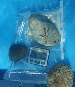 rocks hold water proofed timer on bottom of pool
