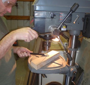 the drill press makes it look easy to poke holes in metal