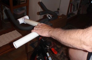 PVC pipe stationary bike handle extender in use