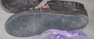 The soles have had adequate traction for all surfaces so far, except packed ice. The uppers were treated once to make them repel moisture.