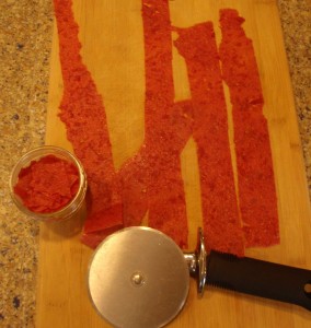 A pizza cutter is a handy tool for cutting your tomato leather down to size.