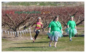 Shamrock Shuffle 2014 - Hitting the grassy final stretch at a full on barefoot sprint. (I don't even remember those ladies there. Probably 5K walkers.)