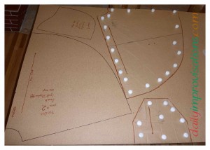 Here I am half way done tracing the original paper sewing pattern onto the hardboard.