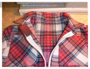 Some polar fleece was used to cushion the sharpish zipper tabs. In this photo you can see one side finished and another yet uncovered.