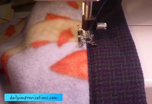 Stitching in the ditch of the seam where I first sewed the edge binding to the main blanket body. 