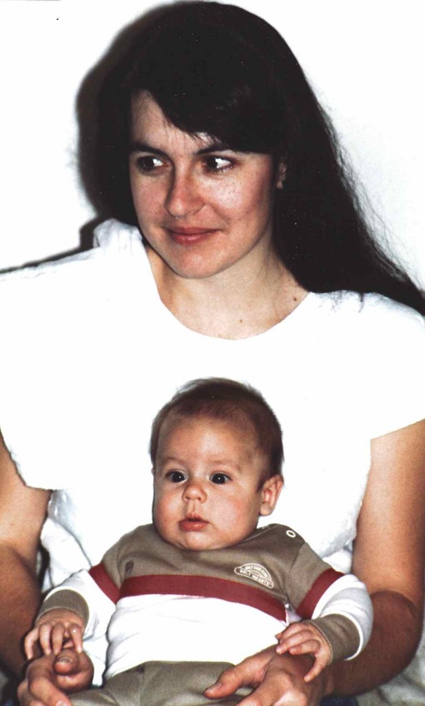 Me in my early 20s with our second baby, just 3 months old